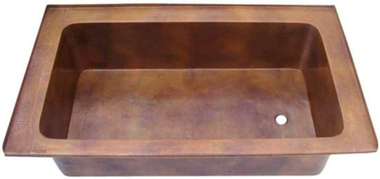 Front view of the Evanston modern copper bathtub drop-in with a hammered copper finish.