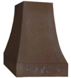 Kansas style copper range hood with a sloping shape, dark patina finish, and apron featuring a decorative design.