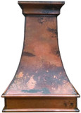 Colonial copper vent hood with an antique hand-hammered finish in a luxury kitchen