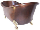 Product Front View: Vermont copper bathtub front view showcasing bronze clawfoot legs and dark patina finish.