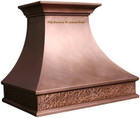 Front view of handmade copper range hood with Norfolk-style design