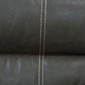 Dark Brown with White Trim Swivel Chair close up