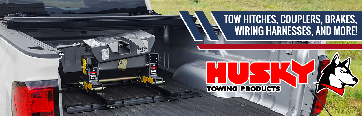 A banner advertising Husky Towing products featuring An image of a tow hitch mounted to a truck bed with the text "Tow Hitches, Couples, Brakes, Wiring Harnesses and More!"