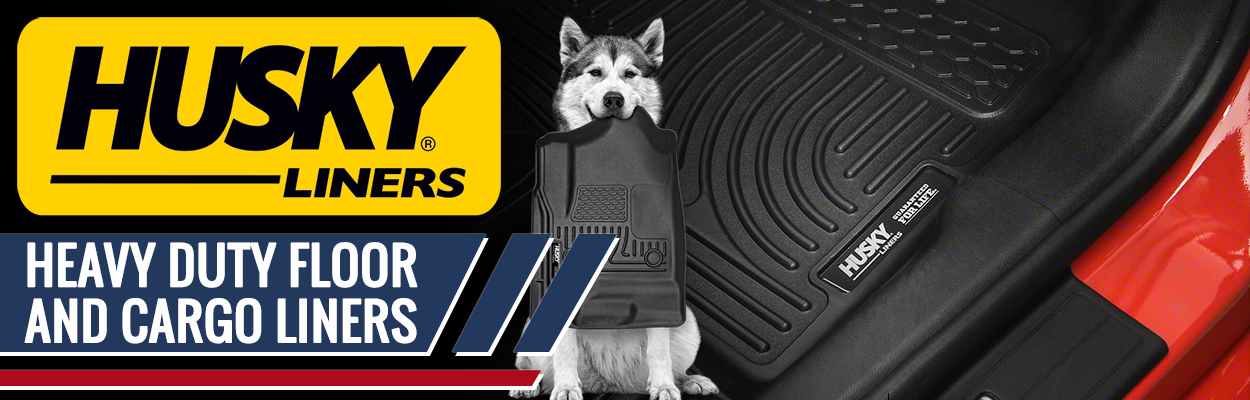 An ad for HUSKY Liners featuring a picture of a dog holding a floor mat, and the text "Heavy duty floor and cargo liners