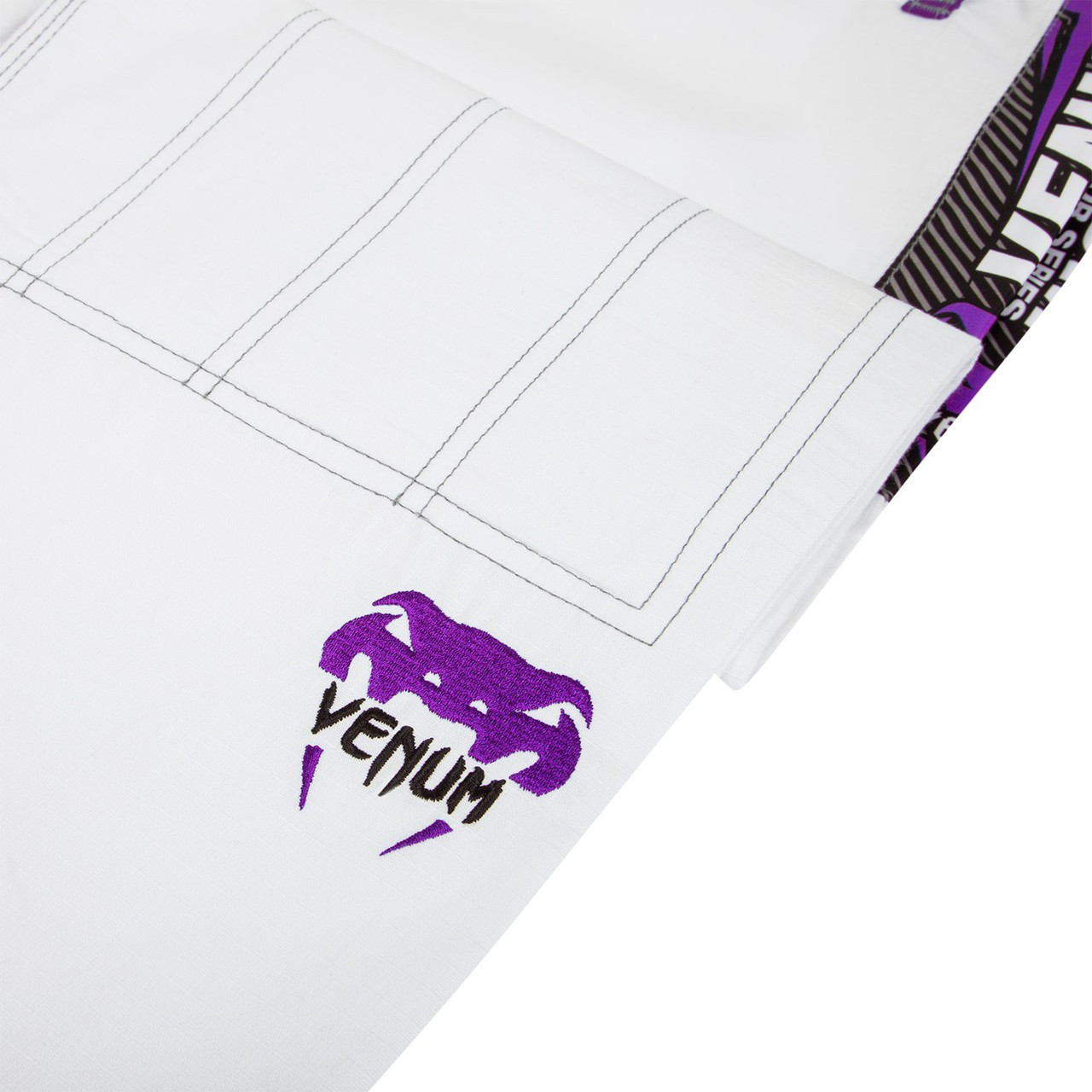 Venum Elite Jiu Jitsu Gi in White and purple.  Now available at www.thejiujitsushop.com Front of gi in white and purple

Enjoy free shipping from The Jiu Jitsu Shop.  Top quality brazilian jiu-jitsu gear for men women and kids.