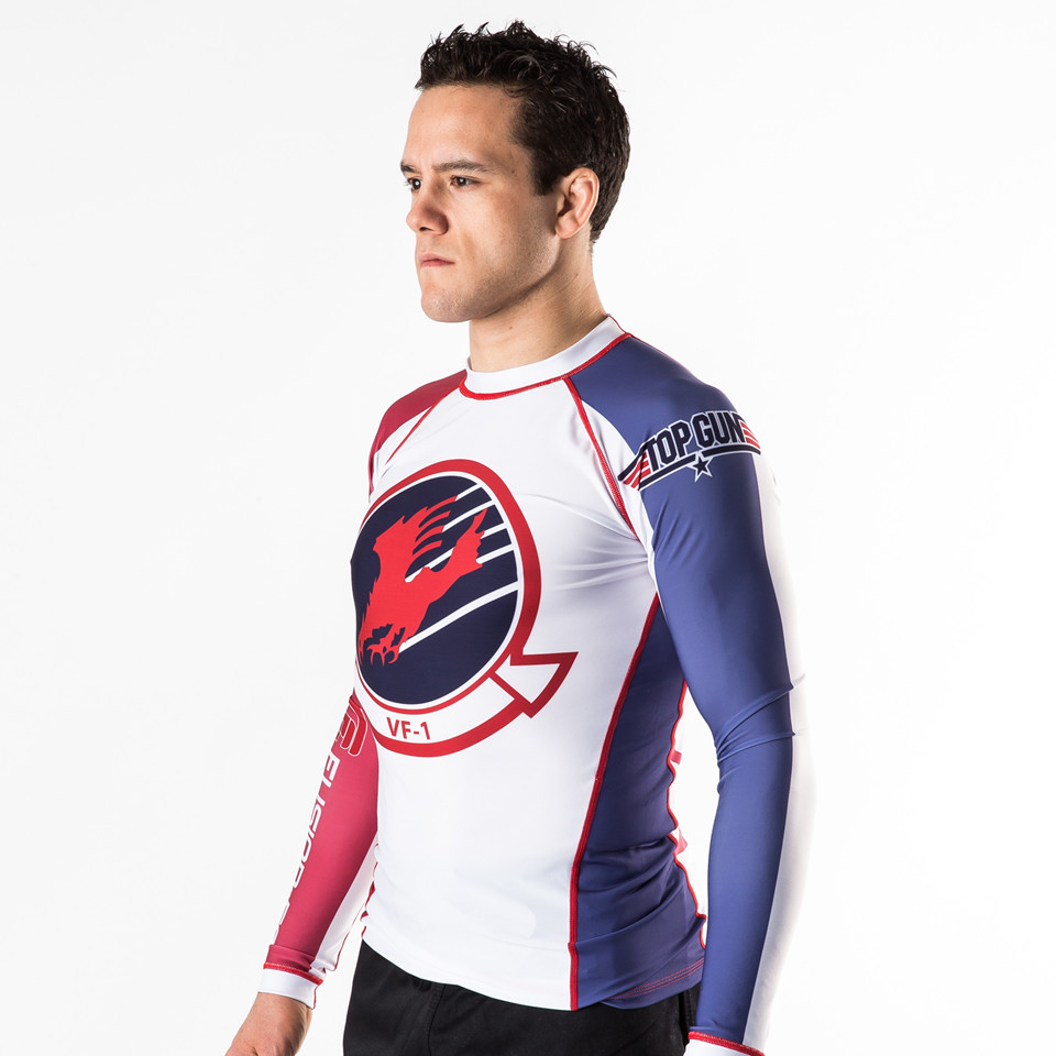 Fusion FG Top Gun Goose Volleyball Rashguard available at www.thejiujitsushop.com volleyball, Goose, Aviators, Tom Cruise.  All things that remind of the 1980s Top Gun fans rejoice amazing rashguard is now here. Back of rashguard has goose and big 86 on it. 

Enjoy Free Shipping from The Jiu Jitsu Shop today!