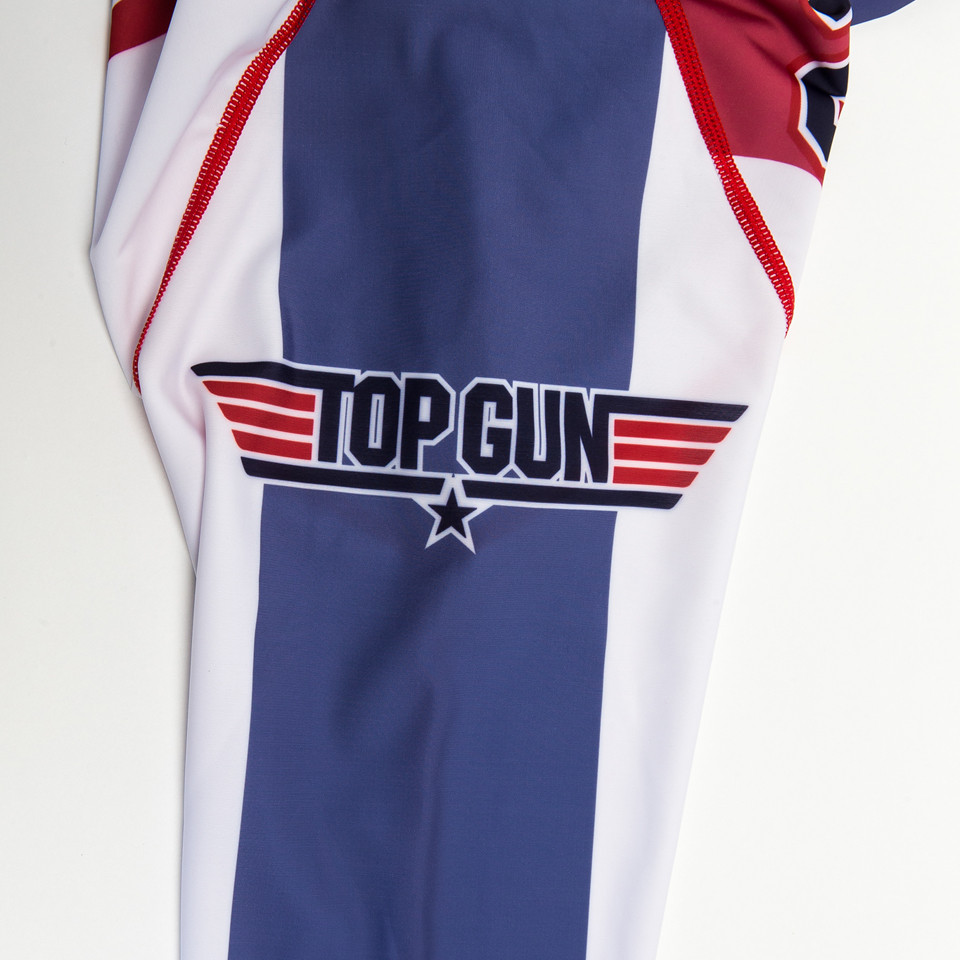 Fusion FG Top Gun Goose Volleyball Rashguard available at www.thejiujitsushop.com volleyball, Goose, Aviators, Tom Cruise.  All things that remind of the 1980s Top Gun fans rejoice amazing rashguard is now here. Back of rashguard has goose and big 86 on it. 

Enjoy Free Shipping from The Jiu Jitsu Shop today!
