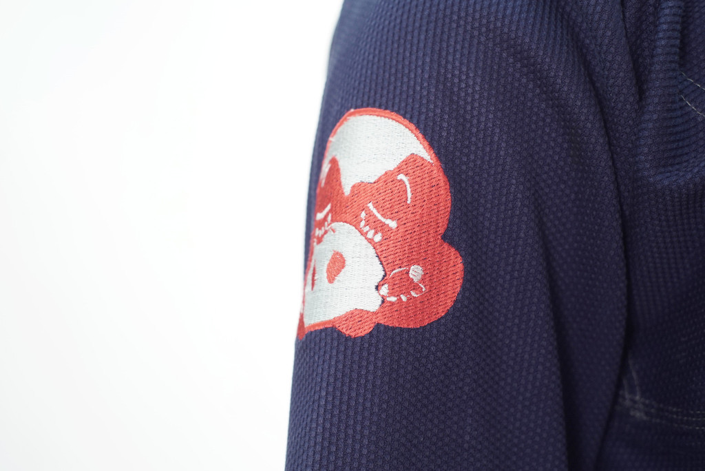 Inverted Gear X Show The Art Collaboration Gi. Navy, red, and white Kimono.  Now available at www.thejiujitsushop.com Shoulder embroidery.

Enjoy Free Shipping from The Jiu Jitsu Shop today.  One stop BJJ Pro Shop.