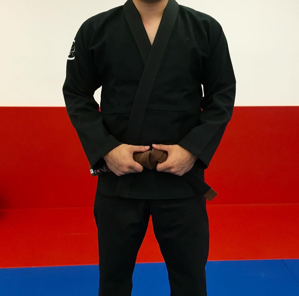 Front Facing TJJS Minimalist Kimono Black with a white patch.  Available at www.thejiujitsushop.com.  The Minimalist Gi is a perfect mix between comfort durability and affordability.  Simple gi.

Enjoy Free Shipping from The Jiu Jitsu Shop today!