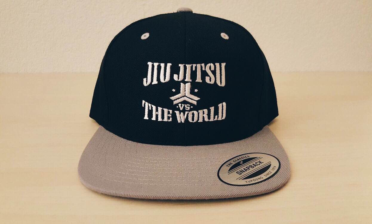 OGA Open Guard Apparel Jiu Jitsu vs The World Snapback hat.  Grey black hat with white embroidery.  Jiu Jitsu vs the world series from Open guard apparel. 

Enjoy Free Shipping on all products storewide today. 