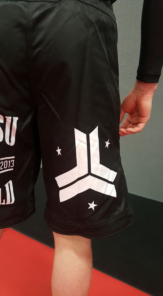 Zoom of the left leg OGA Jiu Jitsu Vs The World Fight Shorts.  Great for BJJ and MMA.  Black and White Grappling Shorts from Open Guard Apparel. 

Available with free Shipping from The Jiu Jitsu Shop.  
