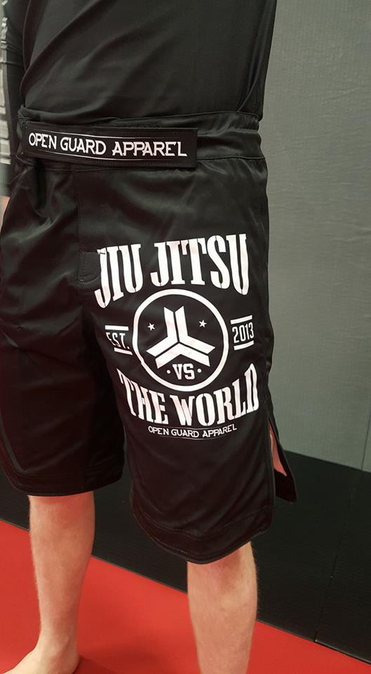 Front left pant leg of the OGA Jiu Jitsu Vs The World Fight Shorts.  Great for BJJ and MMA.  Black and White Grappling Shorts from Open Guard Apparel. 

Available with free Shipping from The Jiu Jitsu Shop.  
