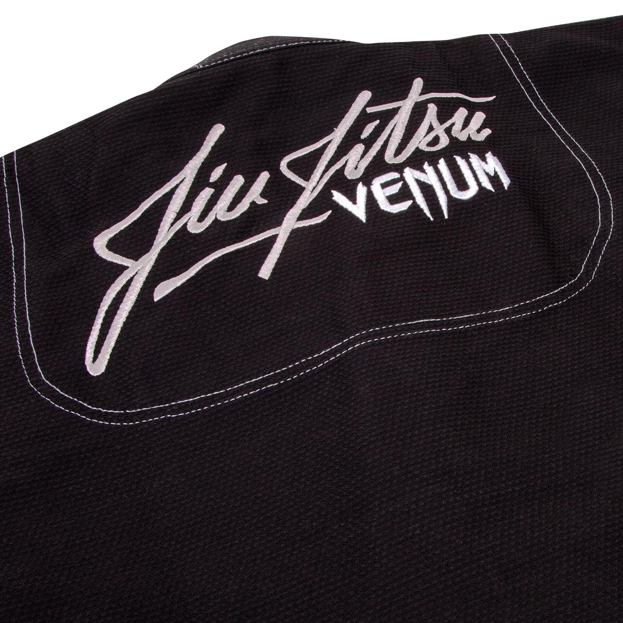 back zoom in view of the Venum challenger 3.0 BJJ Gi Black/Grey Available at www.thejiujitsushop.com

Enjoy Free Shipping from The Jiu Jitsu Shop today! 