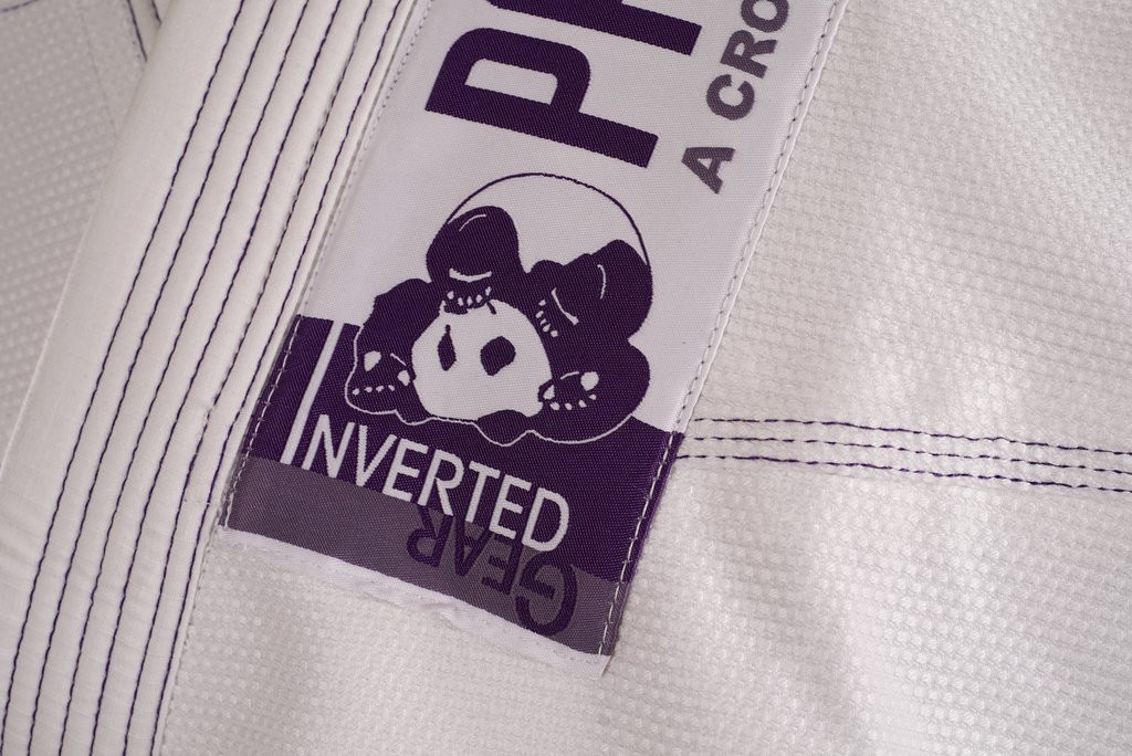 Inverted Gear Panda CS 2.0 .  The revamped crowdsourced gi.  White and purple from The Jiu Jitsu Shop.

Enjoy free shipping today at www.thejiujitsushop.com