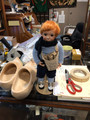 Newspaper boy, red head with freckles on a NARCO stand.