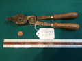 Lead ball mold for .43 with wooden handles.