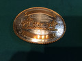 Belt buckle Tony Lamas western scene with brass and German silver.