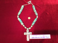 Necklace with a cross, Silver & Turquoise in color.  Nice faux stones. Big!