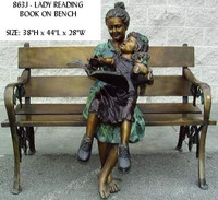 lady reading book on bench