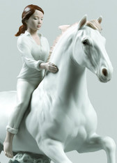 Riding her horse on the seashore Horse & Woman Figurine 01009371