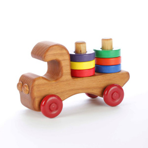 Our wooden stacker truck features six brightly colored removable wooden rings for teaching colors and hand-eye coordination. Made of locally-harvested Oregon alder and finished with non-toxic paints and food-grade mineral oil. Handcrafted in Oregon, USA.