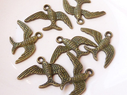Bronze bird charms