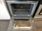 WHIRLPOOL 30 INCH FREE STANDING ELECTRIC RANGE COIL BURNERS 2 LARGE 2 SMALL KEEP WARM OPTION SELF CLEANING OVEN BLACK AND SILVER LOCATED IN OUR PORTLAND OREGON APPLIANCE STORE SKU 18169