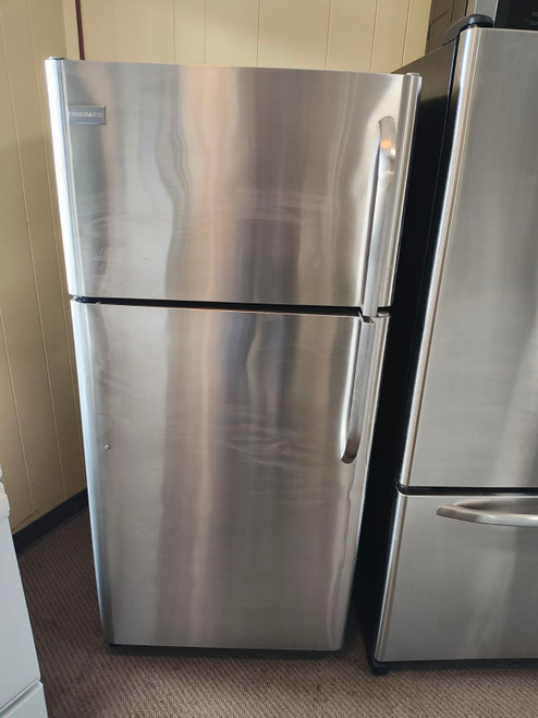 FRIGIDAIRE 18 CUBIC FOOT REFRIGERATOR TOP FREEZER FULL WIDTH GLASS SHELVES 2 CRISPER DRAWERS WIRE SHELF IN REEZER STAINLESS LOCATED IN OUR PORTLAND OREGON APPLIANCE STORE 18300