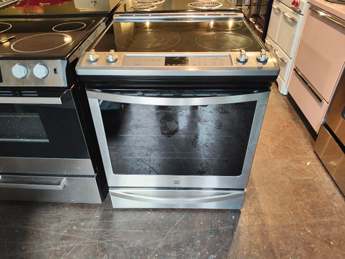 KENMORE BY WHILPOOL 30 INCH SLIDE IN ELECTRIC RANGE 5 BURNER GLASS TOP CENTER WARMING BURNER 1 TRIPLE 1 FAST BOIL AND 2 SMALL RAPID PRE-HEAT KEEP WARM AND LOW TEMP SELF CLEAN LOCATED IN OUR PORTLAND OREGON APPLIANCE STORE SKU 18413