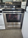 FRIGIDAIRE 30 INCH FREESTANDING ELECTRIC RANGE COIL BURNERS 2 SMALL 2 LARGE SELF CLEANING OVEN STAINLESS FRONT BLACK TOP LOCATED IN OUR PORTLAND OREGON APPLIANCE STORE SKU 18729