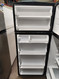ESTATE BY WHIRLPOOL 18 CUBIC FOOT RERIGERATOR TOP FREEZER GLASS SHELVES 1 DELI DRAWER 2 CRISPER DRAWERS GLASS SHELF IN FREEZER SILVER WITH BLACK TRIM LOCATED IN OUR PORTLAND OREGON APPLIANCE STORE SKU 18916