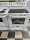 FRIGIDAIRE GALLERY 30 INCH FREESTANDING ELECTRIC RANGE 5 BURNER SMOOTH TOP 1 DUAL 1 EXTRA 2 SMALL PLUS CENTER WARMING SELF CLEANING OVEN COSMETIC ISSUE TOP OF OVEN DOOR SEE PIC LOCATED IN PORTLAND OREGON APPLIANCE STORE SKU 19022