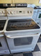 GE 30 INCH FREESTANDING ELECTRIC RANGE HI LO BROIL OPTION SELF CLEANING OVEN SMOOTH TOP 4 BURNERS WHITE LOCATED IN OUR PORTLAND OREGON APPLIANCE STORE SKU 19037