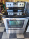 WHIRLPOOL 30 INCH FREESTANDING ELECTRIC RANGE 5 BURNER SMOOTH TOP 1 LARGE DUAL 1 LARGE 2 SMALL 1 WARMING BURNER STEAM CLEAN AND SELF-CLEANING OPTION BLACK STAINLESS LOCATED IN OUR PORTLAND OREGON APPLIANCE STORE SKU 19072