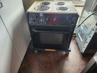 GE 27 INCH DROP IN ELECTRIC RANGE COIL BURNERS 3 SMALL 1 LARGE MANUAL CLEAN OVEN BLACK GLASS OVEN DOOR ALMOND TOP LOCATED IN OUR PORTLAND OREGON APPLIANCE STORE SKU 19074