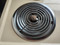 GE 27 INCH DROP IN ELECTRIC RANGE COIL BURNERS 3 SMALL 1 LARGE MANUAL CLEAN OVEN BLACK GLASS OVEN DOOR ALMOND TOP LOCATED IN OUR PORTLAND OREGON APPLIANCE STORE SKU 19074