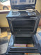 WHIRLPOOL 30 INCH FREESTANDING ELECTRIC RANGE COIL BURNERS 2 LARGE 2 SMALL KEEP WARM OPTION SELF CLEANING OVEN BLACK AND STAINLESS LOCATED IN OUR PORLAND OREGON APPLIANCE SKU 19120