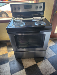 WHIRLPOOL 30 INCH FREESTANDING ELECTRIC RANGE COIL BURNERS 2 LARGE 2 SMALL KEEP WARM OPTION SELF CLEANING OVEN BLACK AND STAINLESS LOCATED IN OUR PORLAND OREGON APPLIANCE SKU 19120
