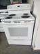 GE 30 INCH FREESTANDING ELECTRIC RANGE COIL BURNERS 2 LARGE 2 SMALL SELF CLEANING OVEN STORAGE DRAWER LARGE VIEWING WINDOW WHITE LOCATED IN OUR PORTLAND OREGON APPLIANCE STORE SKU 19127