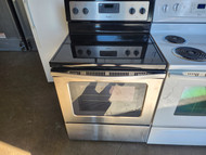 WHIRLPOOL 30 INCH FREESTANDING SMOOTH TOP ELECTRIC RANGE 4 BURNER 1 LARGE DUAL 1 LARGE 2 SMALL MANUAL CLEAN OVEN BLACK AND STAINLESS LOCATED IN OUR PORTLAND OREGON APPLIANCE SKU 19145