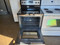 WHIRLPOOL 30 INCH FREESTANDING SMOOTH TOP ELECTRIC RANGE 4 BURNER 1 LARGE DUAL 1 LARGE 2 SMALL MANUAL CLEAN OVEN BLACK AND STAINLESS LOCATED IN OUR PORTLAND OREGON APPLIANCE SKU 19145
