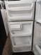 GE 18 CUBIC FOOT REFRIGERATOR TOP FREEZER ADJUSTABLE GLASS SHELVES 2 CRISPER DRAWERS PLUS DELI DRAWER FULL WIDTH WIRE SHELF IN FREEZER WHITE LOCATED IN OUR POTLAND OREGON APPLIANCE STORE SKU 19163