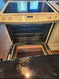 WHIRLPOOL 30 INCH SLIDE-IN ELECTRIC RANGE 4 BURNER 2 LARGE DUAL 2 SMALL KEEP WARM SETTING SELF CLEANING OVEN COSMETIC ISSUE ON OVEN BOTTOM WHITE LOCATED IN OUR PORTLAND OREGON APPLIANCE STORE SKU 19202