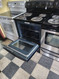GE 30 INCH FREE STANDING ELECTRIC RANGE COIL BURNERS 2 LARGE 2 SMALL HI LO BROIL OPTION SELF CLEAN BLACK LOCATED IN OUR PORTLAND OREGON APPLIANCESTORE 19243