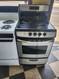 GE 24 INCH FREESTANDING ELECTRIC RANGE SMOOTH TOP WITH 4 BURNERS HI LO BROIL SETTING SELF CLEANING OVEN BLACK AND STAINLESS LOCATED IN OUR PORTLAND OREGON APPLIANCE STORE SKU 19249