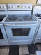 WHIRLPOOL 30 FREESTANDING GLASS TOP RANGE 4 BURNER 2 LARGE 2 SMALL CUSTOM BROIL SELF CLEANING OVEN STORAGE DRAWER WHITE LOCATED IN OUR PORTLAND OREGON APPLIANCE STORE SKU 19268