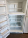 WHIRLPOOL 21 CUBIC FOOT REFRIGERATOR TOP FREEZER ADJUSTABLE GLASS SHELVES 2 CRISPER DRAWERS WIRE SHELF IN FREEZER WHITE LOCATED IN OUR PORTLAND OREGON APPLIANCE STORE SKU 19284