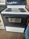 FRIGIDAIRE 30 INCH FREESTANDING ELECTRIC RANGE COIL BURNERS 2 LARGE 2 SMALL SELF CLEANING RANGE BLACK GLASS DOOR WHITE TOP AND BODY LOCATED IN OUR PORTLAND OREGON APPLIANCE STORE SKU 19294