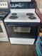 FRIGIDAIRE 30 INCH FREESTANDING ELECTRIC RANGE COIL BURNERS 2 LARGE 2 SMALL SELF CLEANING RANGE BLACK GLASS DOOR WHITE TOP AND BODY LOCATED IN OUR PORTLAND OREGON APPLIANCE STORE SKU 19294