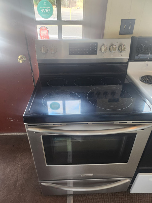 FRIGIDAIRE 30 INCH FREESTANDING 5 BURNER SMOOTH ELECTRIC RANGE CONVECTION QUICK PREHEAT STEAM CLEAN OR SELF CLEAN OPTIONS BLACK AND STAINLESS FRONT LOCATED IN OUR PORTLAND OREGON APPLIANCE STORE SKU 19302
